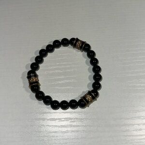 Press black bracelet